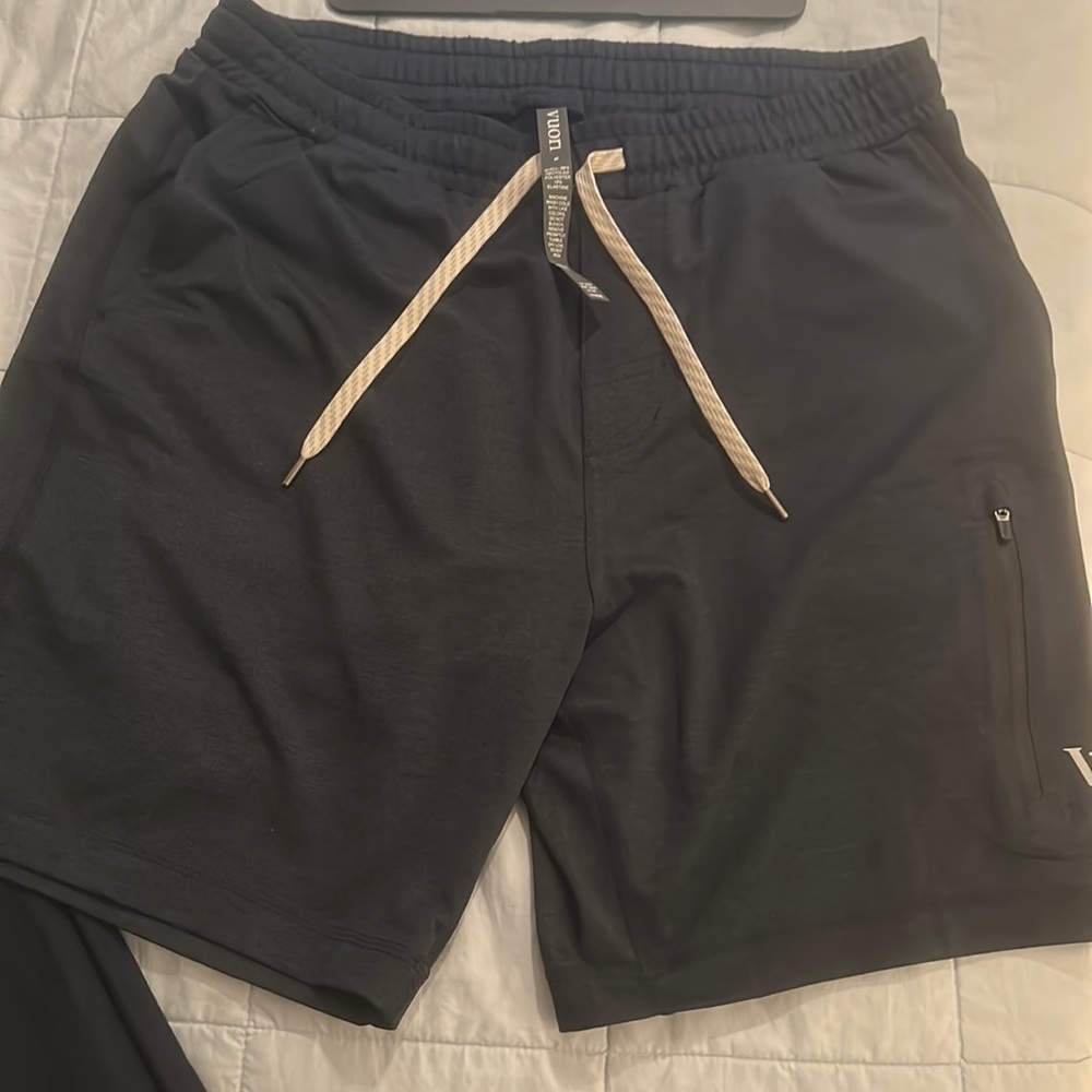 Men’s Vuori performance short, never worn, size medium. Dark blue